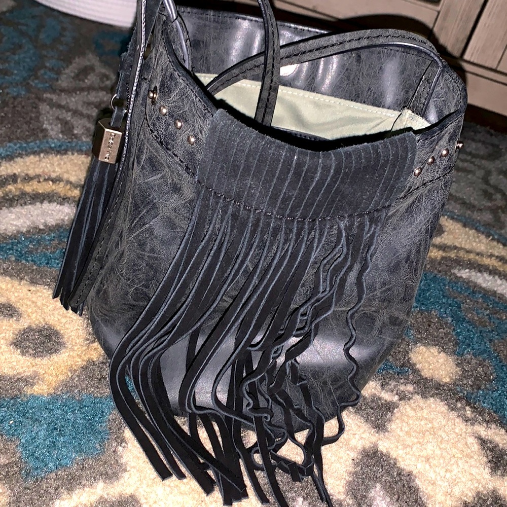 Fairly new crossbody bucket purse w/tassels